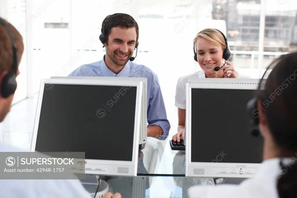 Customer service representatives wearing headsets