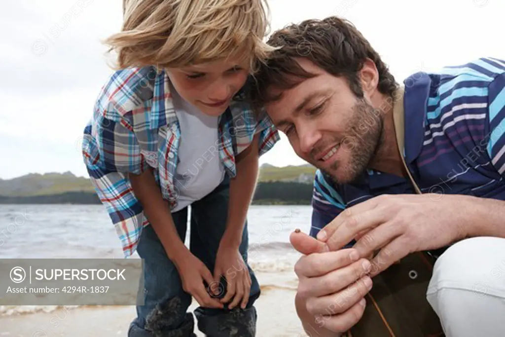 Father and son at a lake