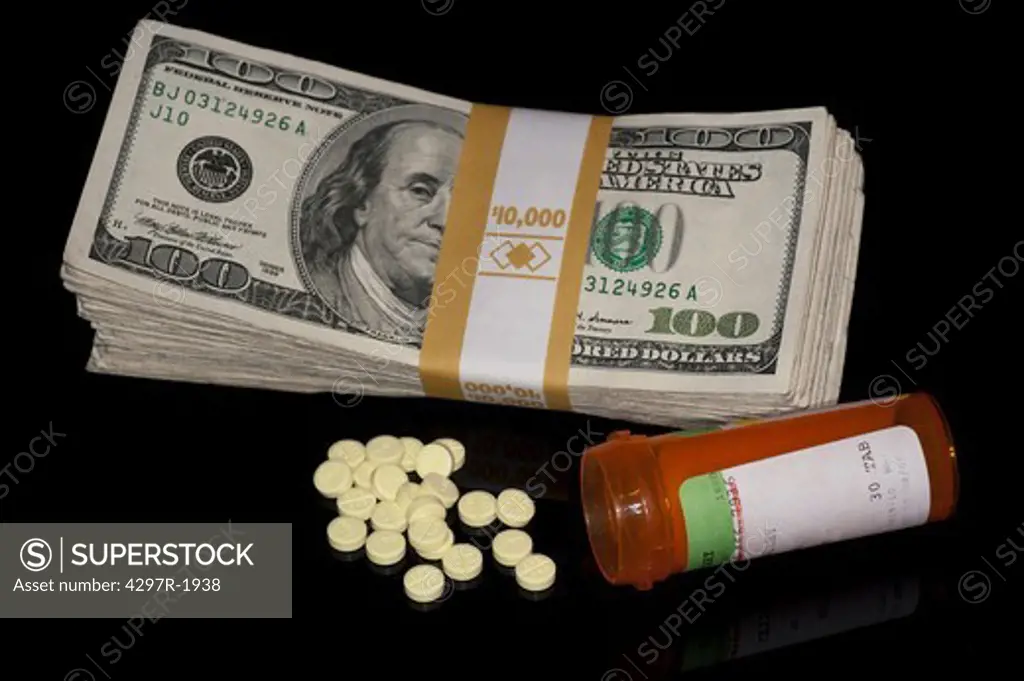 Stack of dollar bills and medications suggesting the rising costs of healthcare
