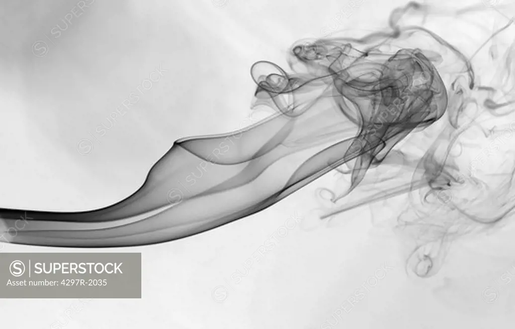 Smoke rising from a matchstick showing turbulent swirls