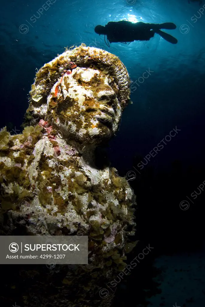 Underwater view of a sculpture with a scuba diver at Cancun Underwater Museum, Cancun, Quintana Roo, Yucatan Peninsula, Mexico
