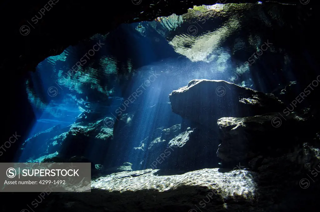 Mexico, Riviera Maya, Cenote Chac-Mool, Sun beams entering cave near Puerto Aventuras