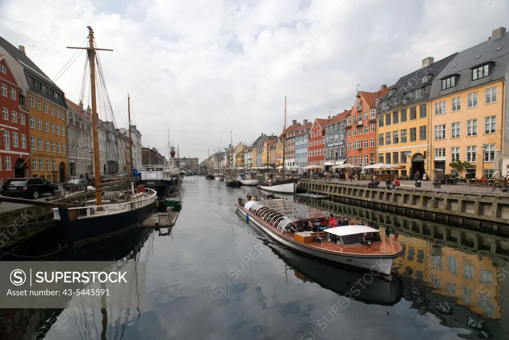 Reflection of boats and clouds on water, Nyhavn, Copenhagen, Denmark
