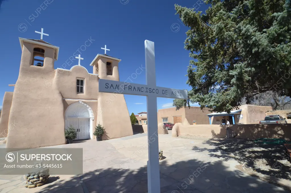 Cross in front of a church, San Francisco De Asis Church, Ranchos De Taos, New Mexico, USA