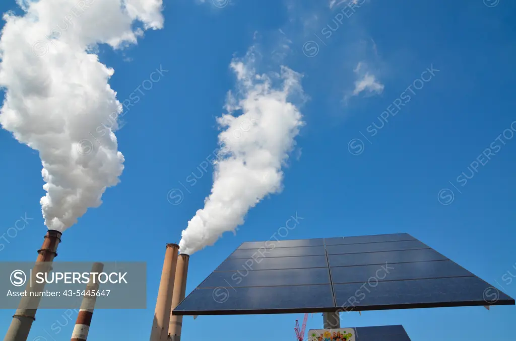 USA, Florida, Apollo Beach, Smoke Stacks And Solar Panel at Teco Big Bend Power Station
