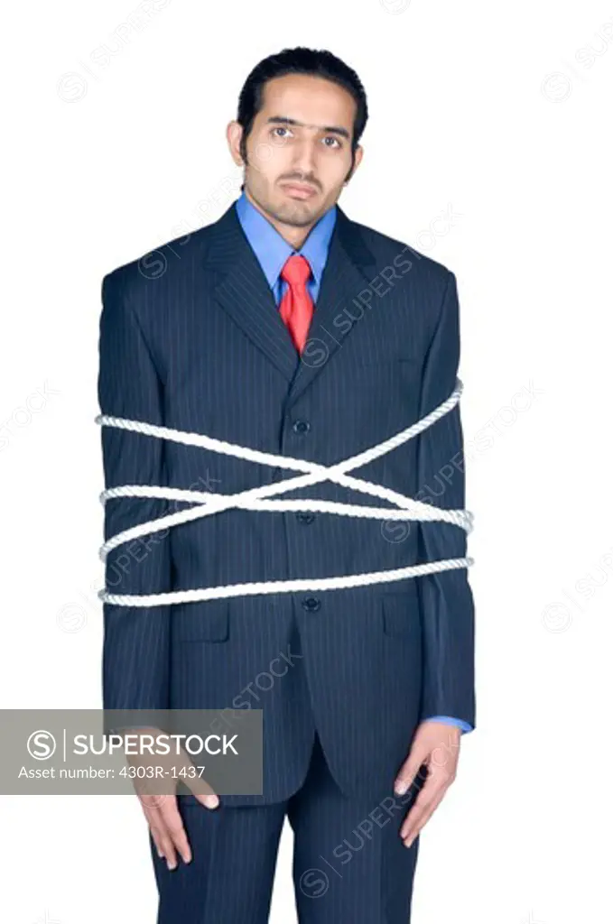 Businessman tied up with rope, portrait