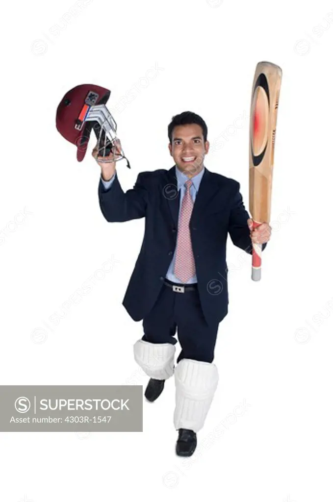 Businessman holding bat and sports helmet, smiling, portrait
