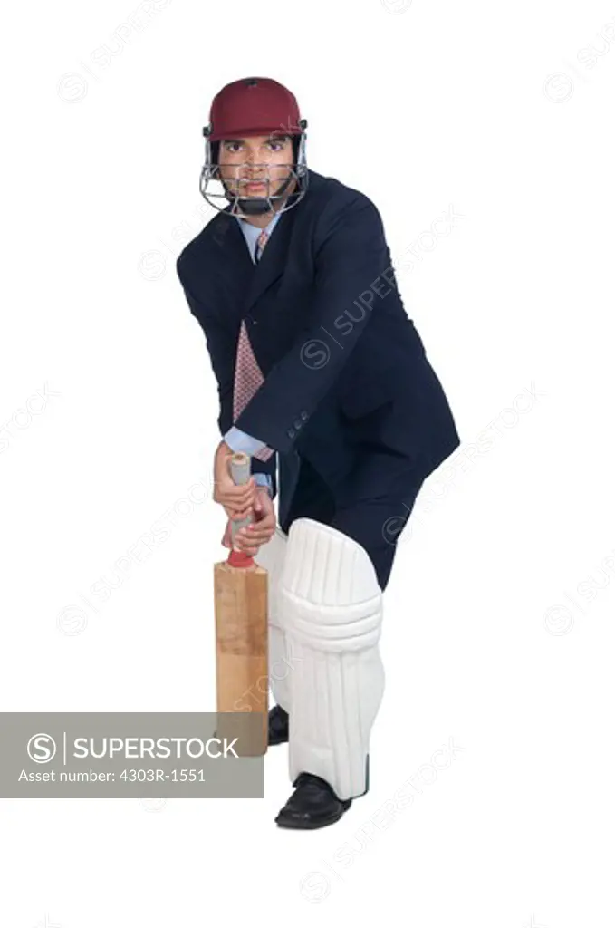 Businessman holding bat, portrait