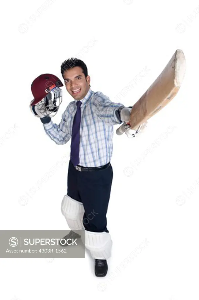 Businessman holding bat and sports helmet, smiling, portrait