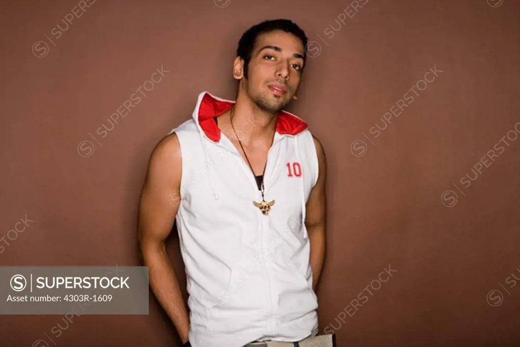 Young man against colored background, portrait