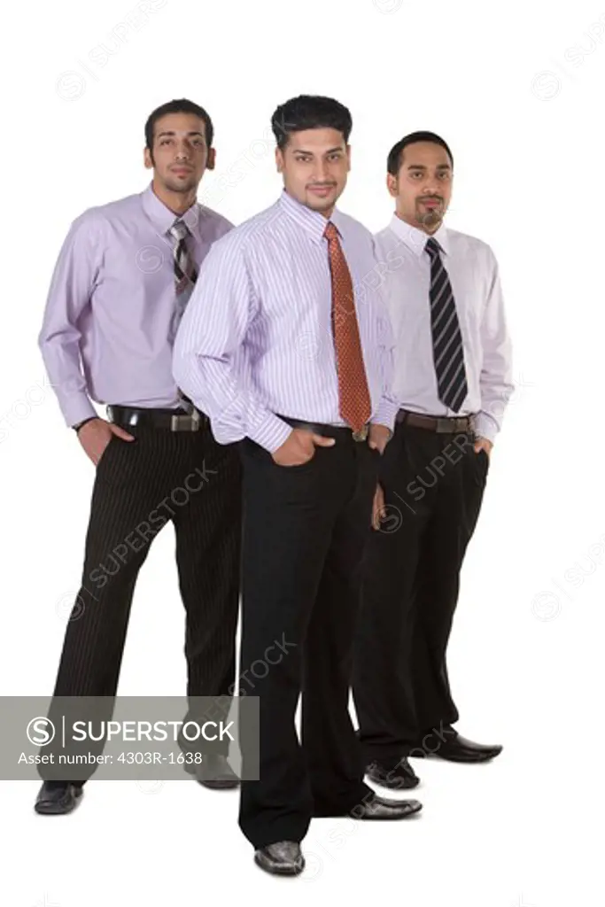 Businessmen standing with hands in pocket, portrait