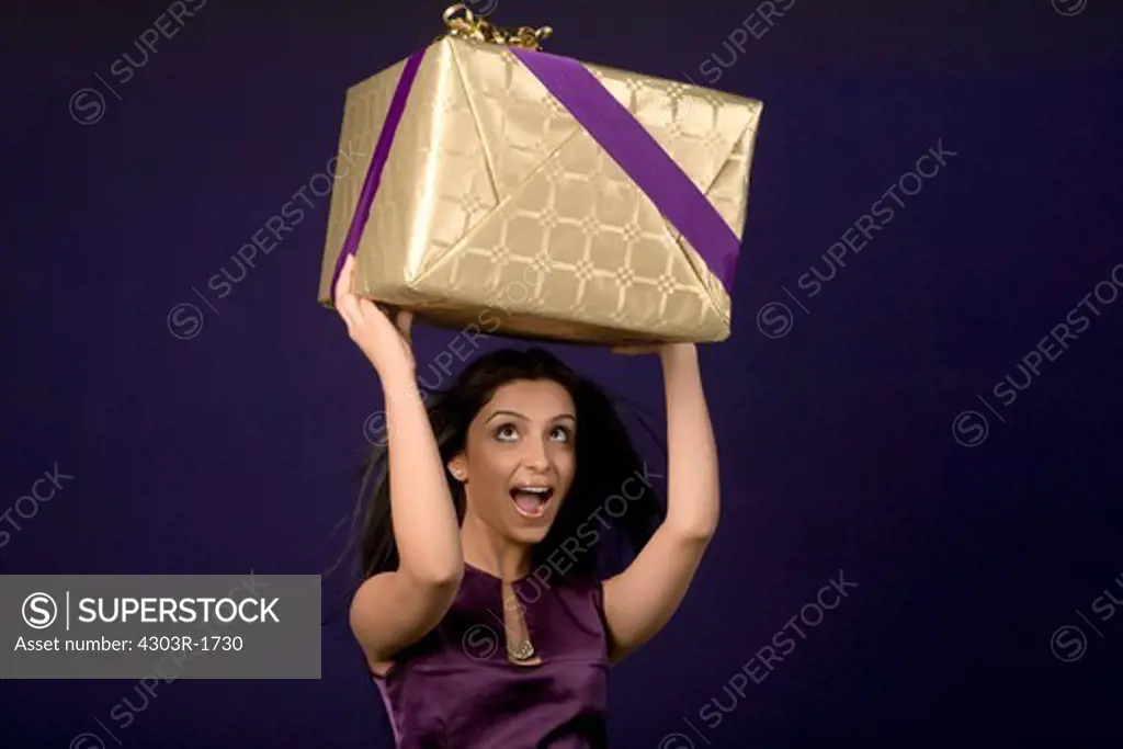 Young woman holding gift
