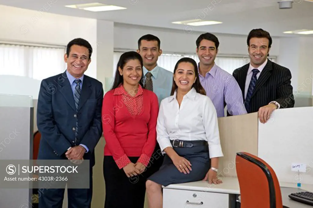 Group of businesspeople looking at the camera, smiling