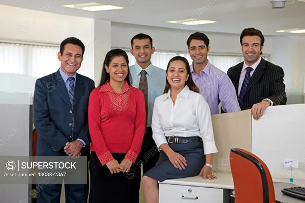 Group of businesspeople looking at the camera, smiling