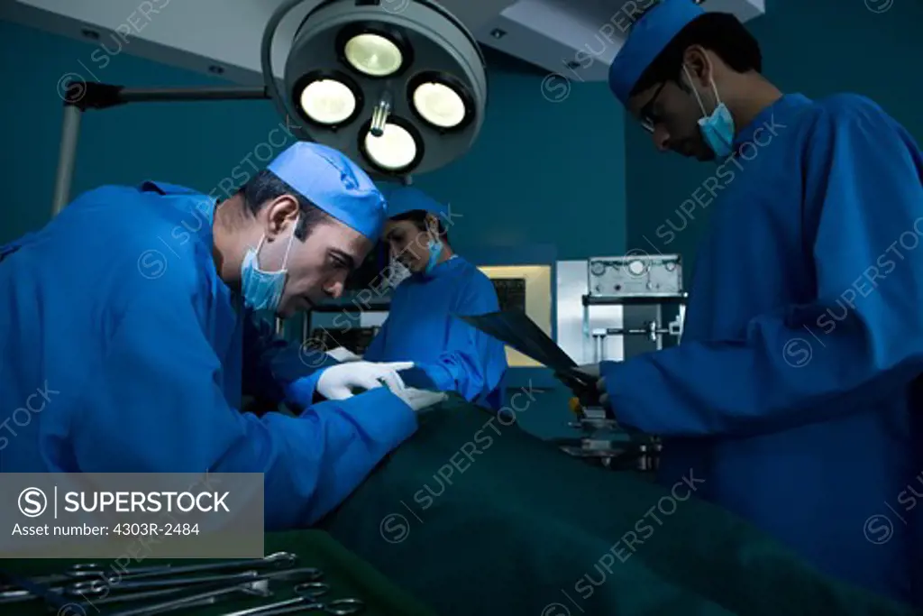 Surgical team performing an operation