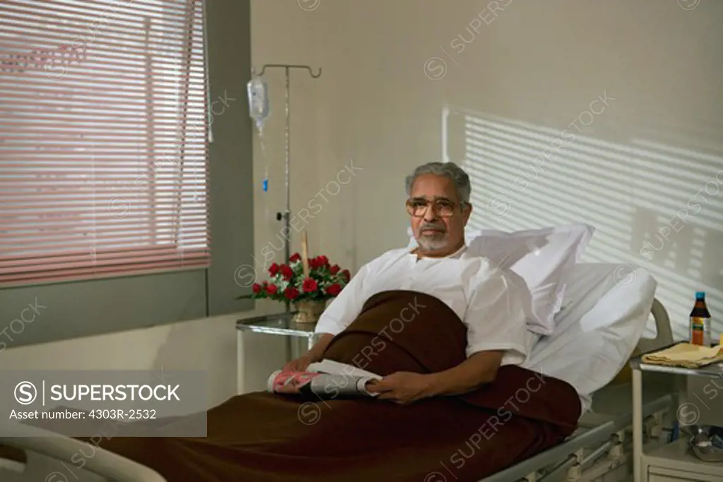 Old man patient in hospital bed