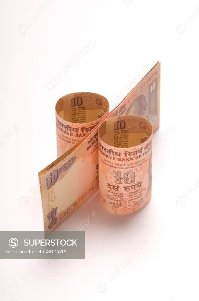 Ten Indian Rupees forming a percentage symbol
