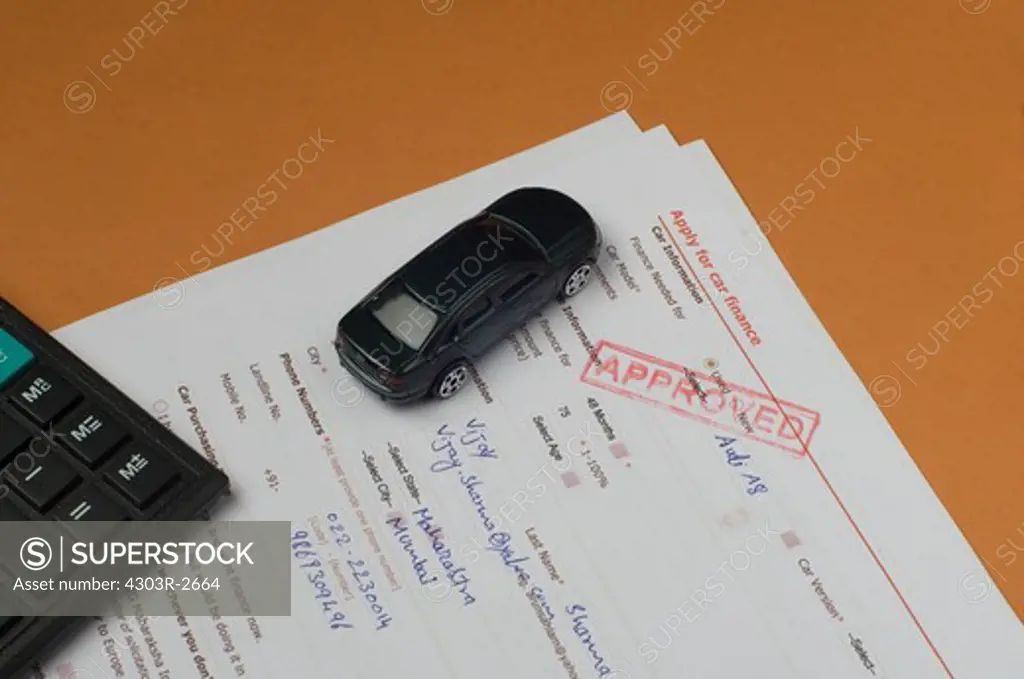 Toy car and loan application form
