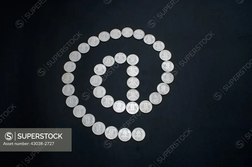 One indian rupee coins forming an @ sign