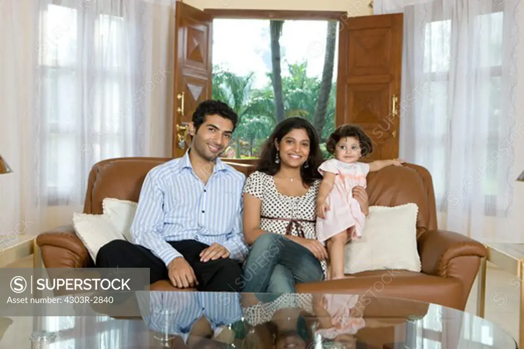 Portrait of family sitting on the sofa
