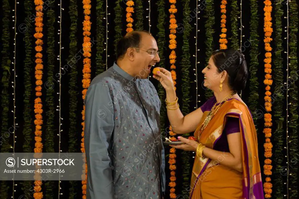 Senior Indian couple celebrating diwali