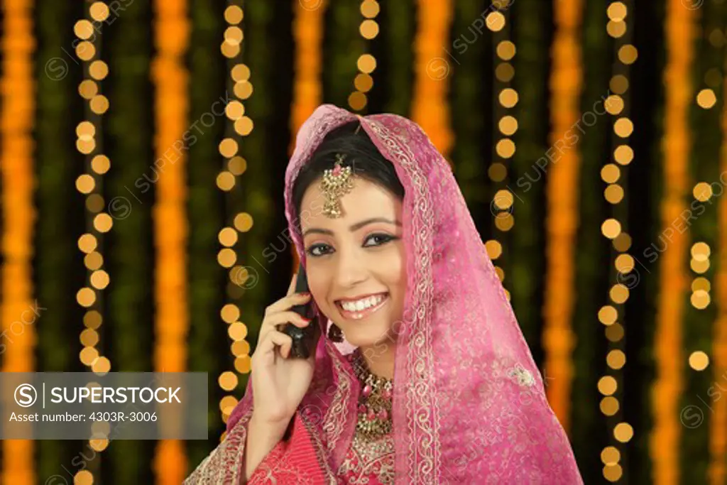 Indian bride talking on her cellphone