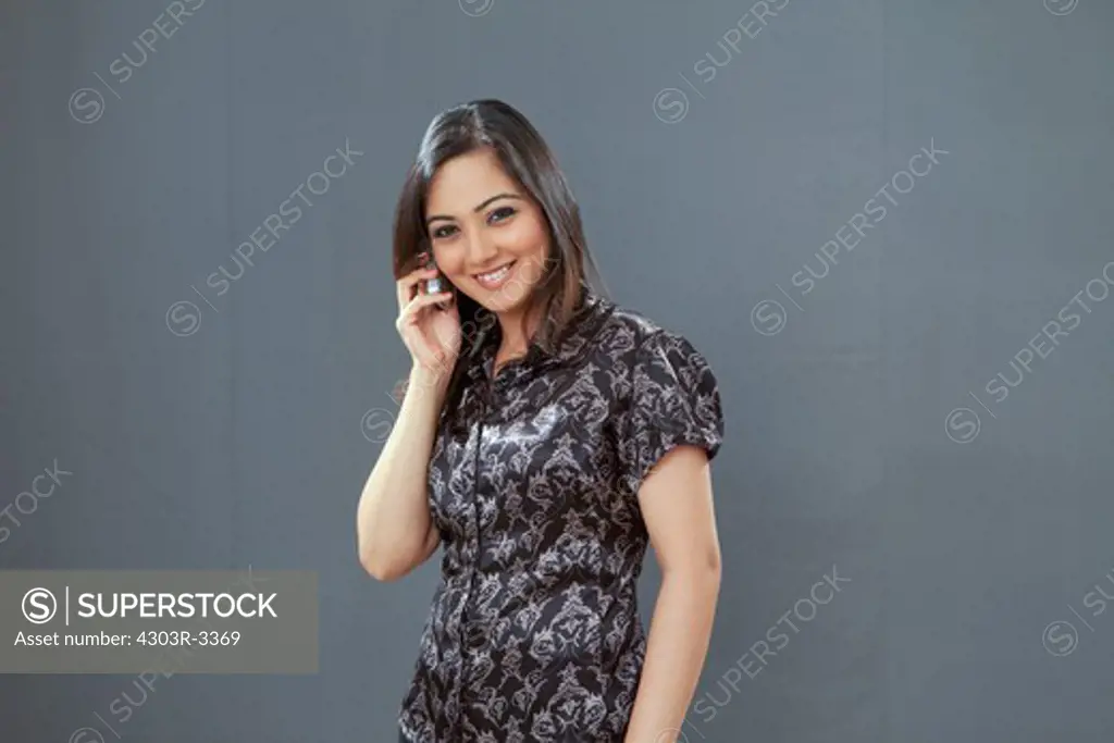 Woman with cellphone, smiling