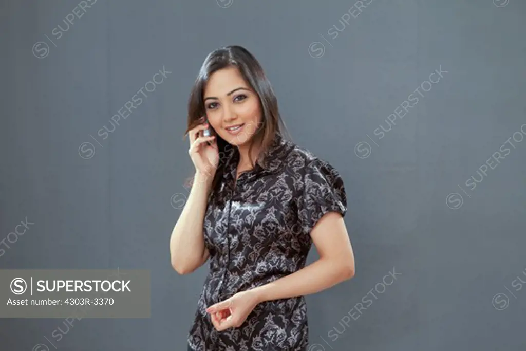 Woman with cellphone, smiling