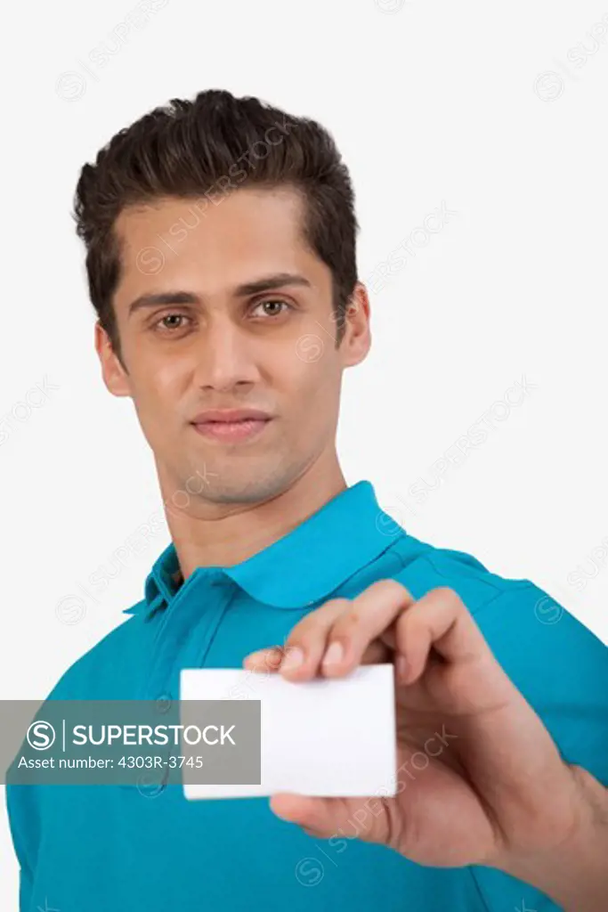 Man holding a small blank card.