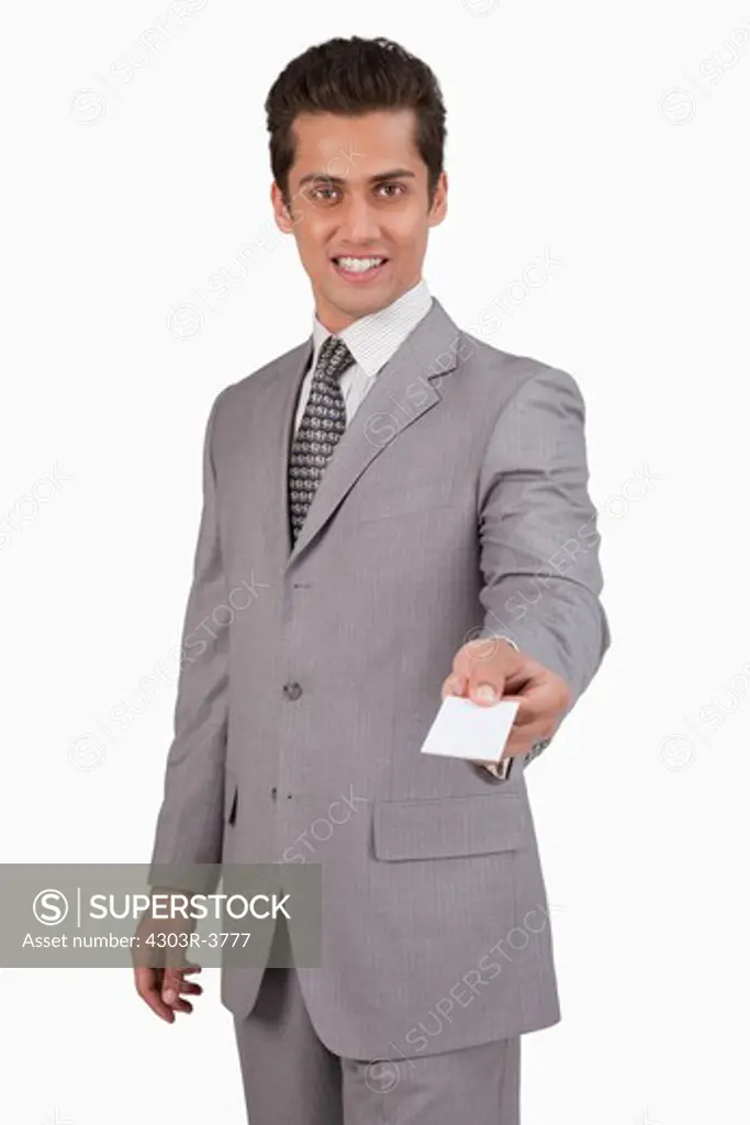 Businessman holding a small blank card.