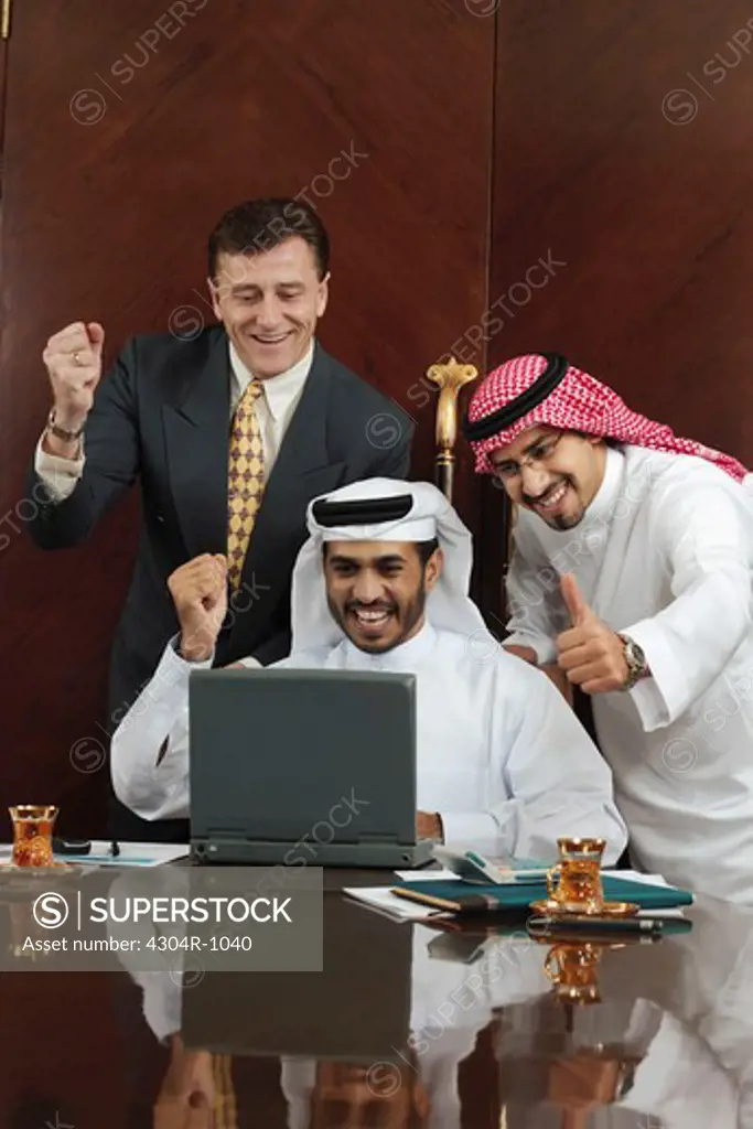 Businessmen at the office happy