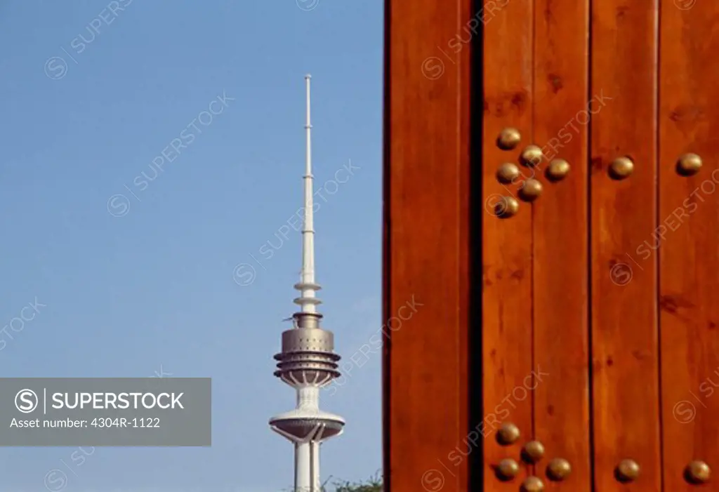 Liberation tower in the city of Kuwait along side a door
