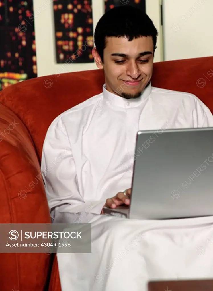 Arab boy with laptop
