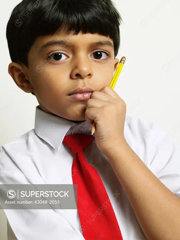 School Boy holding pencil