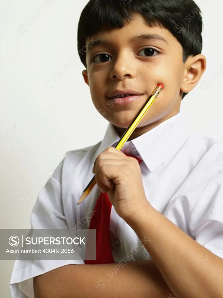 School Boy holding pencil