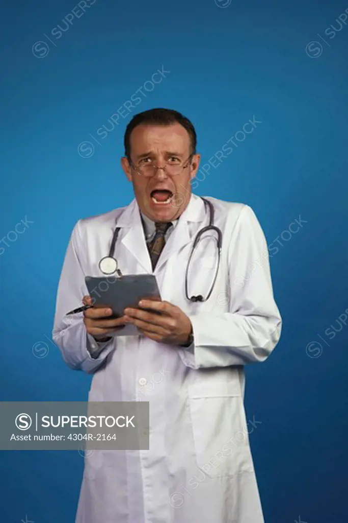 An Optimistic doctor with a log book looking at camera.