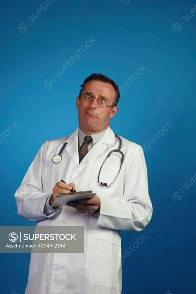 A Optimistic doctor with a log book looking at camera.