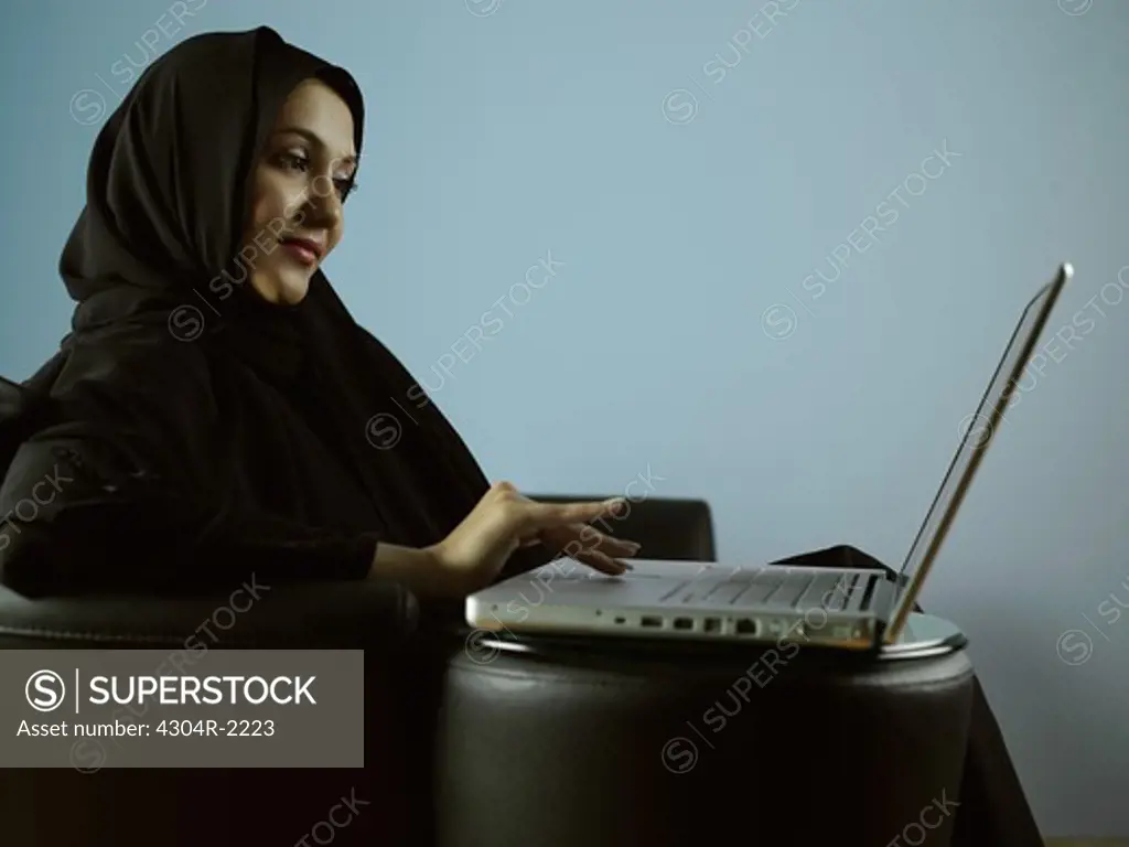 An Arab lady working on computer