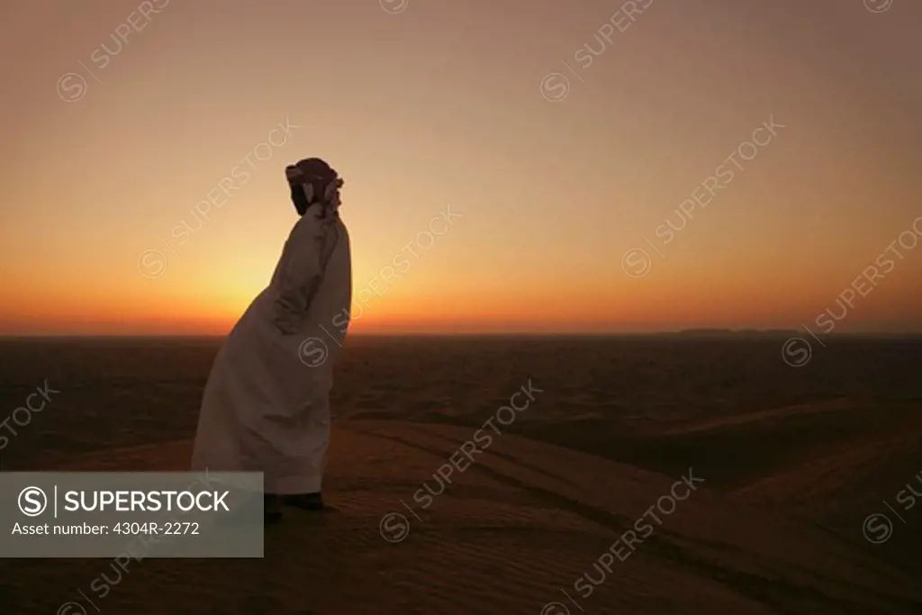 Arab Man watching the sunset