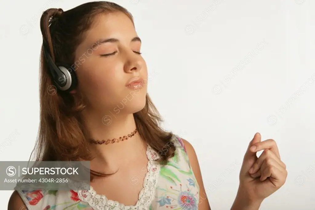 Young girl enjoys listening the music