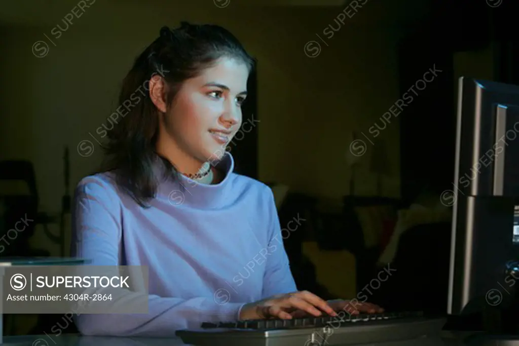 Young girl busy on the computer.