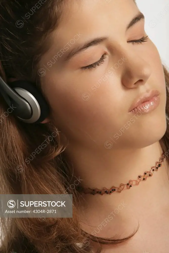 Young girl enjoys listening the music