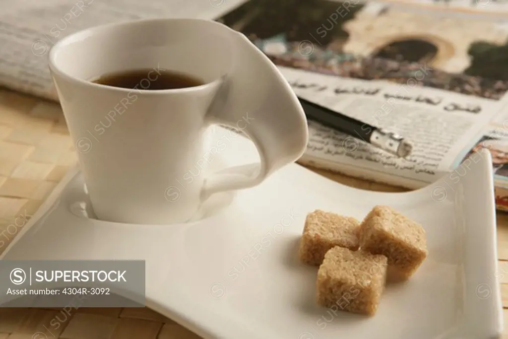 Cup of coffee and sugar.