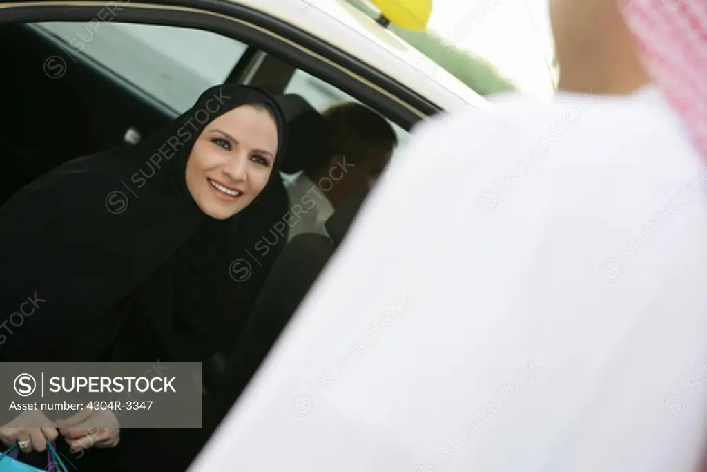 Arab lady inside the car