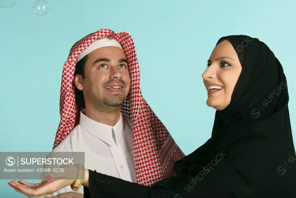 Arab couple playing the bubbles
