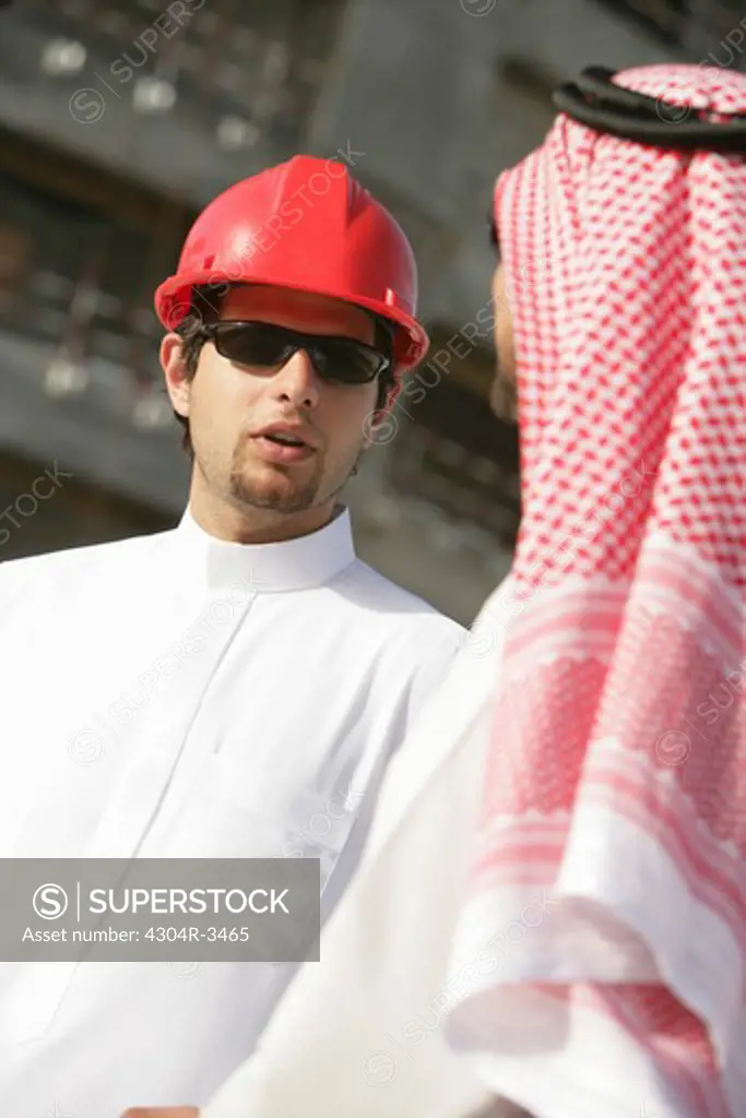 Arab Businessmen talking at the construction site