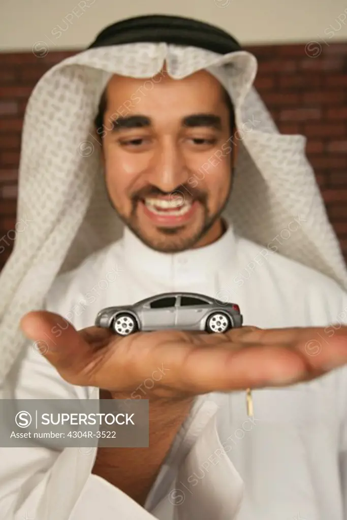 Arab Man with a toy car
