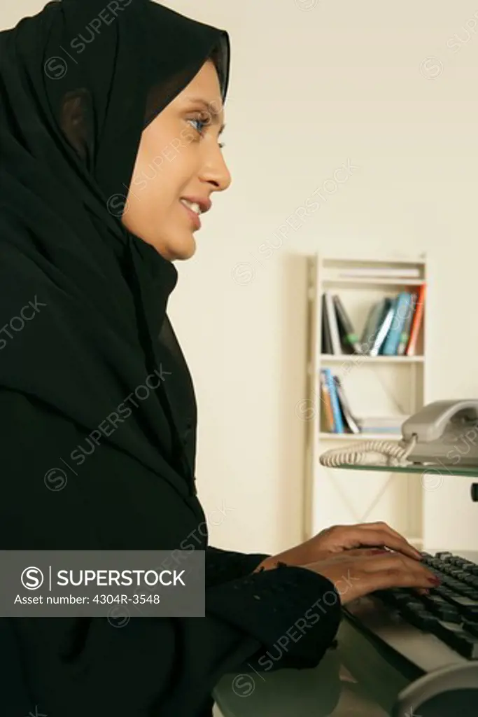 Arab lady busy on the computer