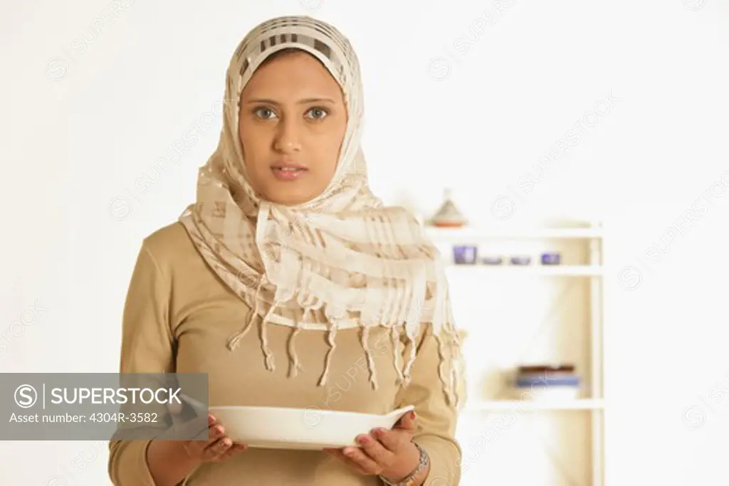 Arab Lady holding serving dish
