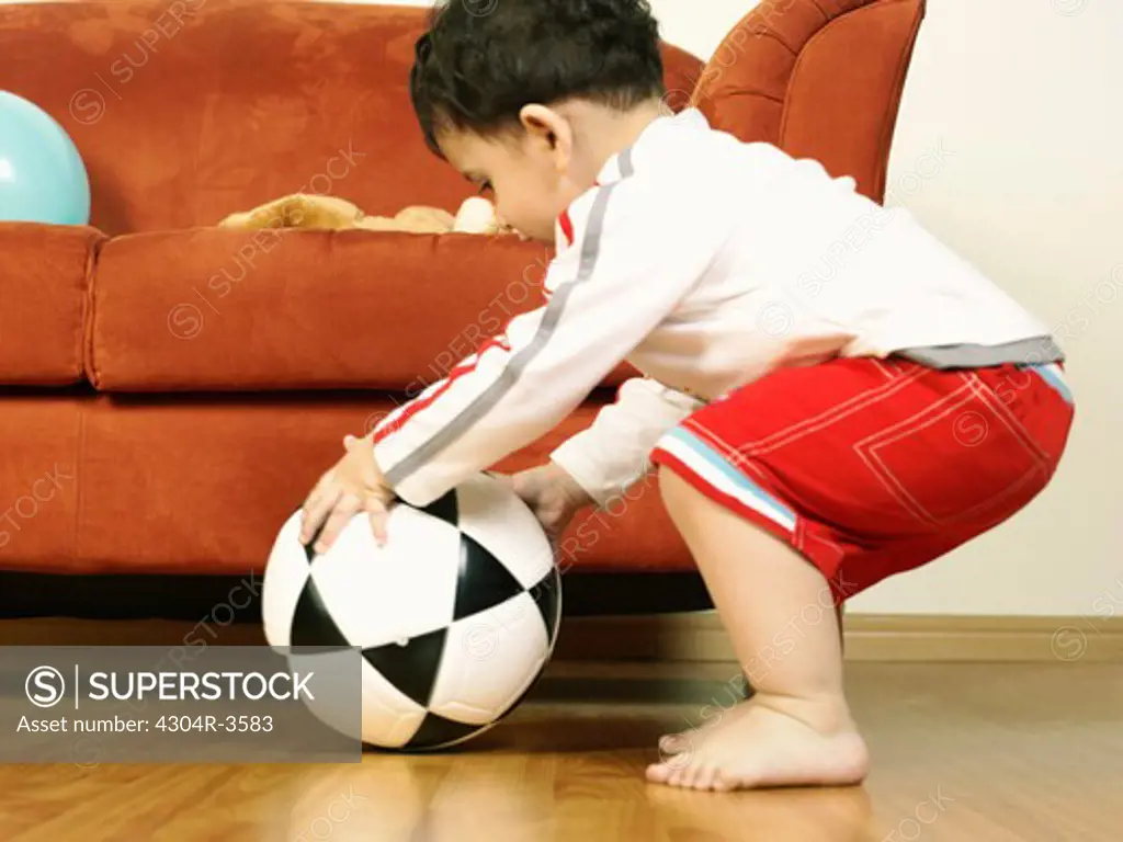 Baby playing the football